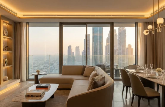 Modern luxury serviced apartment living room with skyline views in Dubai.
